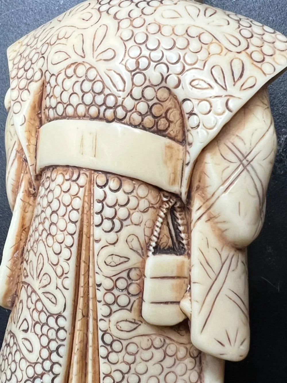 Hand-carved Japanese figurine likely a samurai or similar figure